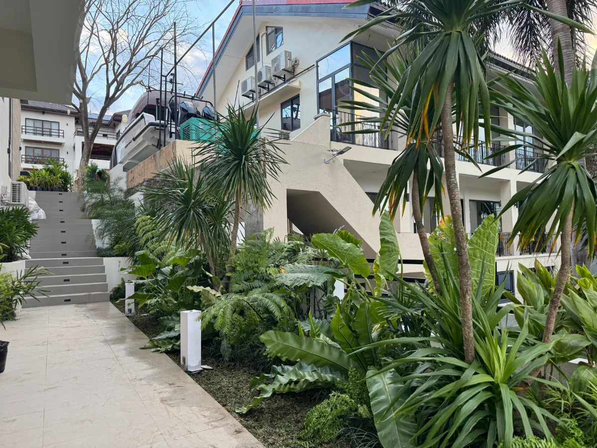 Tropical planting with dracaena and palms along terraced stairs at Peninsula de Punta Fuego, Nasugbu
